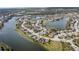 Aerial view showcasing a beautiful residential community nestled around a scenic lake at 5623 Superior Dr, Lakeland, FL 33805