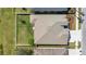 Aerial view of a well maintained roof, backyard, and driveway with manicured landscaping at 5623 Superior Dr, Lakeland, FL 33805