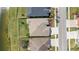 Aerial view of a well maintained roof, backyard, and driveway with manicured landscaping at 5623 Superior Dr, Lakeland, FL 33805