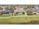 Backyard view featuring a well-manicured lawn and a white picket fence near the water's edge at 5623 Superior Dr, Lakeland, FL 33805