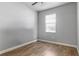 Bedroom featuring a single window and hardwood floors at 5623 Superior Dr, Lakeland, FL 33805