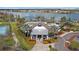 Aerial shot of the community clubhouse with a pool, playground, and tennis court near the lake at 5623 Superior Dr, Lakeland, FL 33805