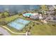 Aerial view of the tennis courts, pool and clubhouse enhance this community at 5623 Superior Dr, Lakeland, FL 33805