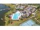 Aerial view of the tennis courts, pool, playground and clubhouse enhance this community at 5623 Superior Dr, Lakeland, FL 33805