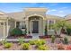 Inviting entrance with lush landscaping and a stylish front door at 5623 Superior Dr, Lakeland, FL 33805