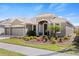 Charming single-story home with lush landscaping, a covered entry, and a well-maintained lawn at 5623 Superior Dr, Lakeland, FL 33805