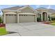 Charming single-story home with a three-car garage and well-manicured landscaping at 5623 Superior Dr, Lakeland, FL 33805