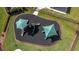 Aerial view of a playground with green shaded slides, mulch and manicured grass at 5623 Superior Dr, Lakeland, FL 33805