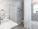 Cozy bathroom with shower, tub, and exterior access at 567 Silver Course Radl, Ocala, FL 34472