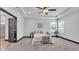 Bright bedroom with tray ceiling, neutral colors, and natural light at 5806 Valentino Way, Lakeland, FL 33812