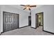 Bedroom features closet, ceiling fan, and an ensuite bathroom at 5806 Valentino Way, Lakeland, FL 33812