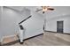 Hallway featuring carpet stairs and gray walls with black trim and doors at 5806 Valentino Way, Lakeland, FL 33812