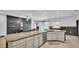 Kitchen island with granite countertops, cabinetry, and pendant lighting at 5806 Valentino Way, Lakeland, FL 33812