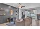 Comfortable living room with gray accent wall and sliding glass door to backyard at 5806 Valentino Way, Lakeland, FL 33812