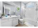 Well-lit bathroom offering a shower/tub combination, white vanity, and neutral tile flooring at 6160 Broad Oak Dr, Davenport, FL 33837