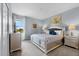 Serene bedroom with plush carpeting, a stylish bed frame, and a sunny window at 6160 Broad Oak Dr, Davenport, FL 33837