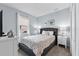 Bedroom featuring a bed, two side tables with lamps, and window at 6160 Broad Oak Dr, Davenport, FL 33837