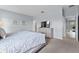 Light-filled bedroom with a dresser and adjoining doorway at 6160 Broad Oak Dr, Davenport, FL 33837