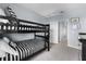 Bunk bed in a bedroom with gray walls and carpet, offering a practical sleeping arrangement at 6160 Broad Oak Dr, Davenport, FL 33837