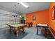 Finished garage converted to a game room with a pool table, foosball table, and air hockey at 6160 Broad Oak Dr, Davenport, FL 33837