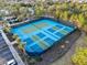 Aerial view of multiple tennis courts providing ample space for recreational enjoyment at 6160 Broad Oak Dr, Davenport, FL 33837