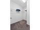 Walk-in closet with wire shelving and carpeted floor at 6160 Broad Oak Dr, Davenport, FL 33837