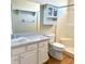 Bathroom featuring white vanity, sink, and shower with tiled surround at 6193 Magpie Dr, Lakeland, FL 33809