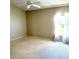 Bright, carpeted bedroom with a ceiling fan and a sunny window at 6193 Magpie Dr, Lakeland, FL 33809