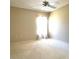 Bedroom with natural light, ceiling fan, neutral walls, and carpeting at 6193 Magpie Dr, Lakeland, FL 33809