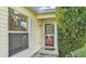 Close-up of the front door and adjacent window, showcasing the home's entrance detail at 6193 Magpie Dr, Lakeland, FL 33809