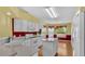 Well-lit kitchen with modern appliances, including white cabinets, island, and fixtures at 6193 Magpie Dr, Lakeland, FL 33809