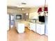 Bright, spacious kitchen with white cabinetry, center island, and modern appliances at 6193 Magpie Dr, Lakeland, FL 33809