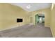 Inviting living room with carpet flooring and a ceiling fan and lots of natural light at 6193 Magpie Dr, Lakeland, FL 33809