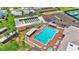 Aerial shot of community pool, shuffleboard, and shuffleboard with poolside seating at 6193 Magpie Dr, Lakeland, FL 33809