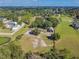 Scenic aerial view of the property featuring pasture, barn, and surrounding landscape at 6615 Broken Arrow S Trl, Lakeland, FL 33813