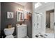 Bathroom with a skylight, a modern vanity, and a shower-tub combo at 6615 Broken Arrow S Trl, Lakeland, FL 33813