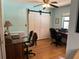 Bedroom featuring a closet with sliding doors, a ceiling fan, and hardwood floors at 6615 Broken Arrow S Trl, Lakeland, FL 33813