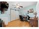 Bright bedroom with a large closet, a ceiling fan and a sunlit window with a view at 6615 Broken Arrow S Trl, Lakeland, FL 33813