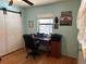 Bedroom featuring a closet with sliding doors, a ceiling fan, and hardwood floors at 6615 Broken Arrow S Trl, Lakeland, FL 33813