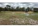 Exterior view of the property with new wooden fencing surrounding the land at 6615 Broken Arrow S Trl, Lakeland, FL 33813