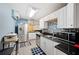 Modern kitchen with stainless steel appliances, white cabinets, and backsplash at 6615 Broken Arrow S Trl, Lakeland, FL 33813