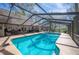 Lovely pool with screened enclosure for comfortable outdoor living and entertaining at 6615 Broken Arrow S Trl, Lakeland, FL 33813