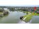Breathtaking aerial view of a lakefront property with private dock, highlighting its serene setting at 7410 Locksley Ln, Lakeland, FL 33809