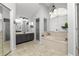 Large bathroom features tile flooring, dual sinks, soaking tub with a bay window, and walk-in shower at 7410 Locksley Ln, Lakeland, FL 33809