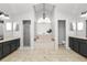 Spacious bathroom features dual sinks, a soaking tub under a bay window, and a glass shower at 7410 Locksley Ln, Lakeland, FL 33809
