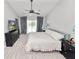 Bedroom with a view of the pool, a ceiling fan, and neutral decor at 7410 Locksley Ln, Lakeland, FL 33809