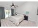 Relaxing bedroom features a king bed and sliding glass door access to the pool at 7410 Locksley Ln, Lakeland, FL 33809