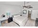 Bedroom featuring a vanity, ceiling fan, and neutral paint at 7410 Locksley Ln, Lakeland, FL 33809