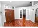 The front entrance boasts beautiful wooden doors and floors, creating a warm invitation at 7410 Locksley Ln, Lakeland, FL 33809