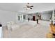 Spacious living room with an open floor plan and view of the kitchen and backyard at 7410 Locksley Ln, Lakeland, FL 33809